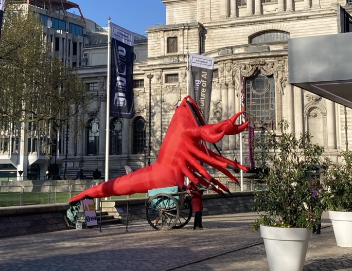 Photo of a house-sized lobster on a cart at the entrance of the AI Engineer Europe 2026 conference in London